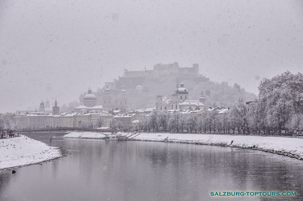 Planning your trip to Salzburg? Discover the ideal time to visit based on seasonal weather, from warm summer days to snowy winter landscapes. Snow-covered Salzburg landscape during January winter weather