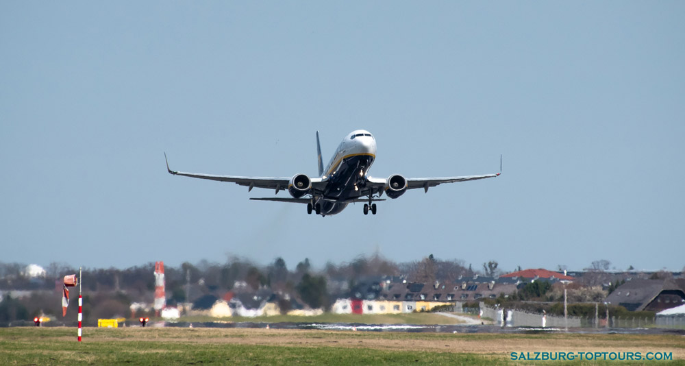 The airplane is landing at Salzburg Airport.